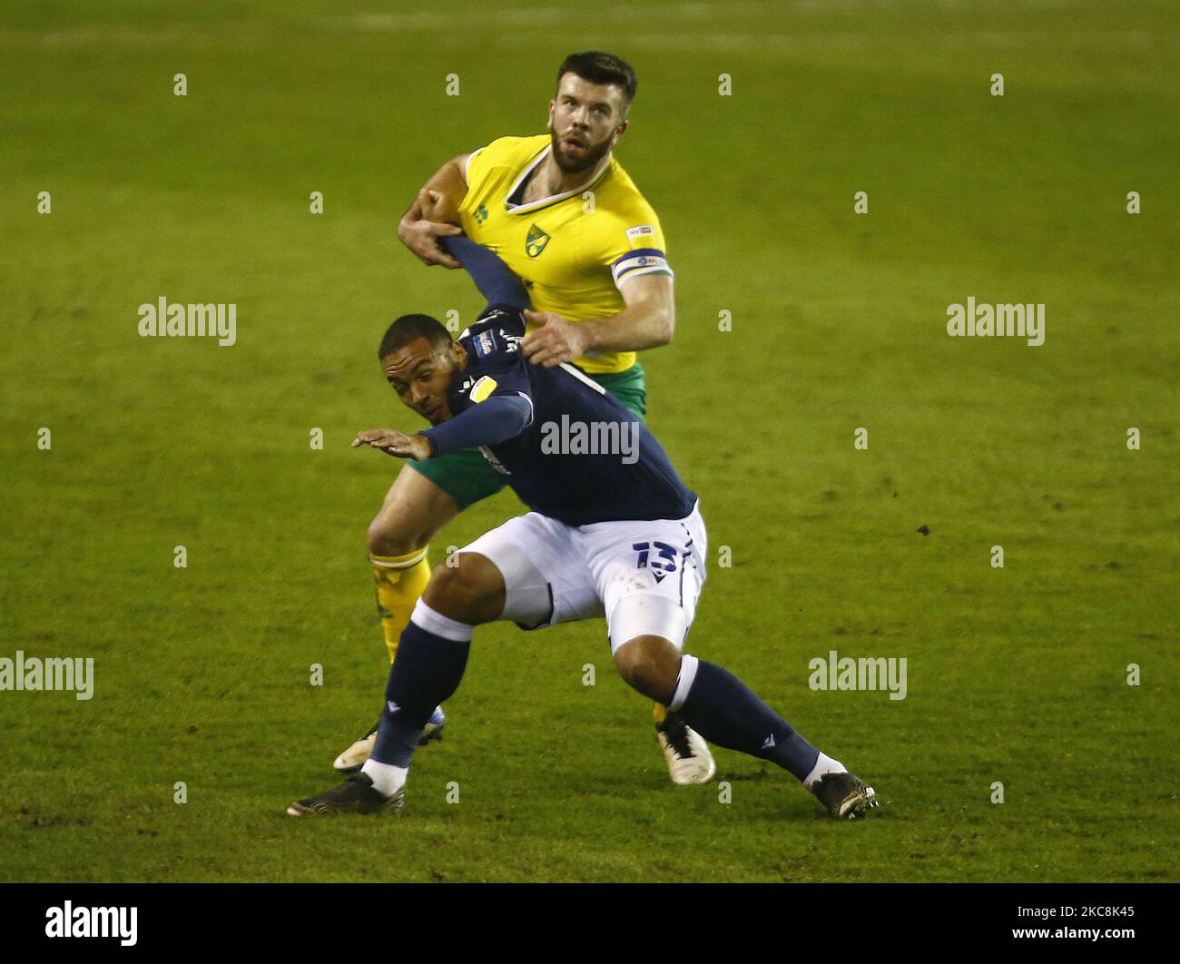 Kenneth Zohore of Millwall tussle with Norwich City's Grant Hanley during The Sky Bet Championship between Millwall and Norwich City at The Den Stadium, London on 2nd February, 2021 (Photo by Action Foto Sport/NurPhoto) Stock Photo