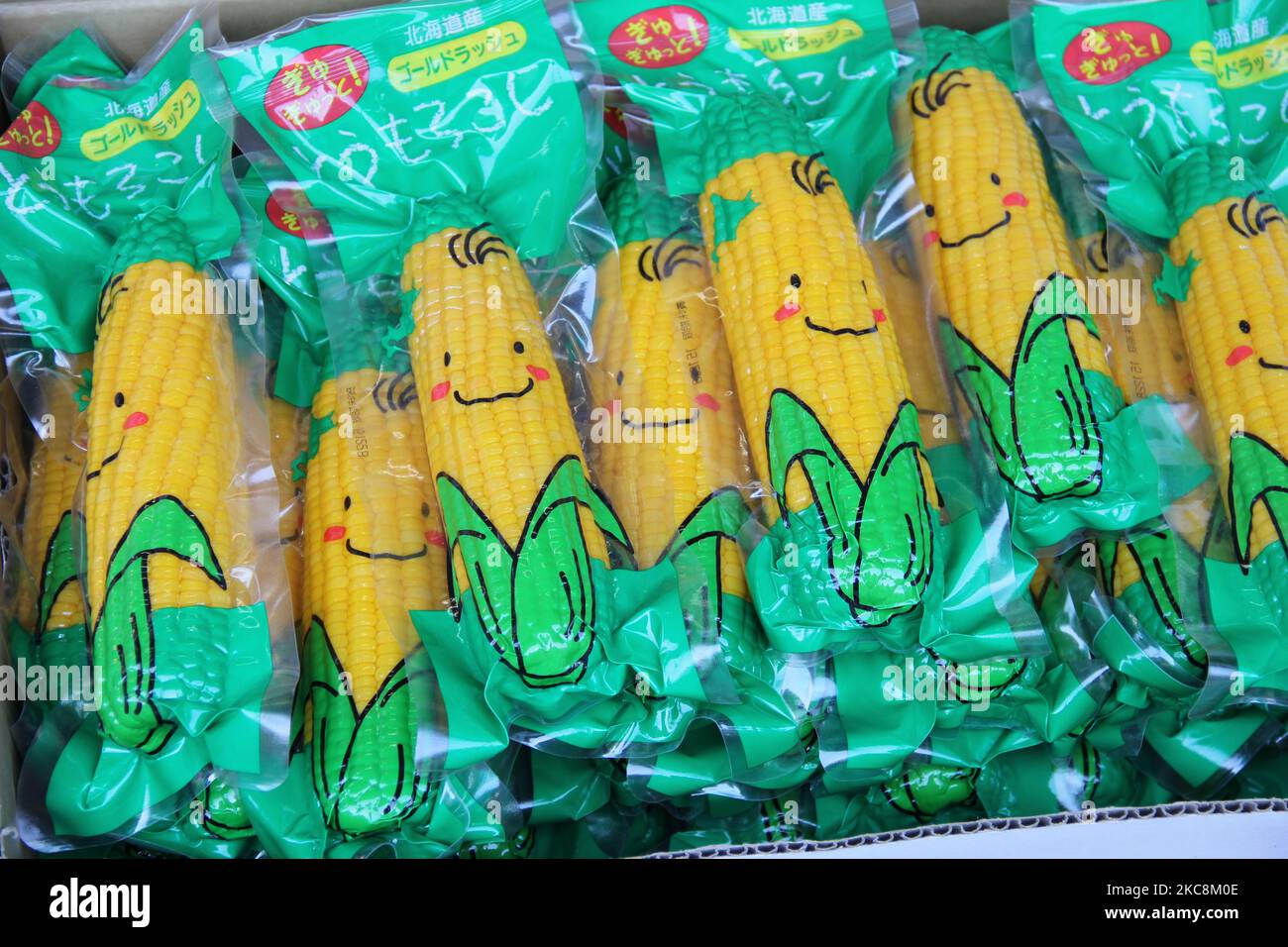 A closeup shot of vacuum packed corn in a funny package in a Japanese