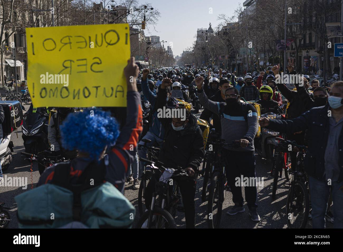 Delivery workers during the demonstration on Thursday, February 4 in Barcelona, Spain, against the proposed law: 'Rider Law'. (Photo by Pau de la Calle/NurPhoto) Stock Photo