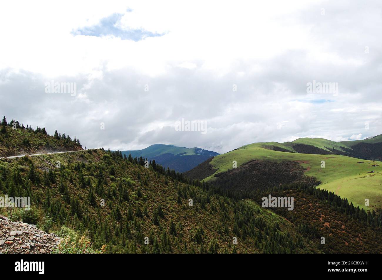 A beautiful view of green hills with a cloudy sky background Stock ...