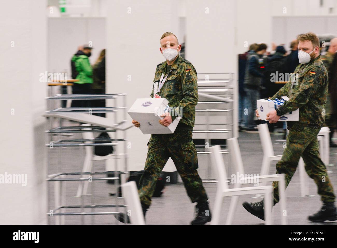 Bundeswehr soldiers are seen helping in Cologne messe during the coronavirus vaccination, in Cologne, Germany, on February 8, 2021. (Photo by Ying Tang/NurPhoto) Stock Photo