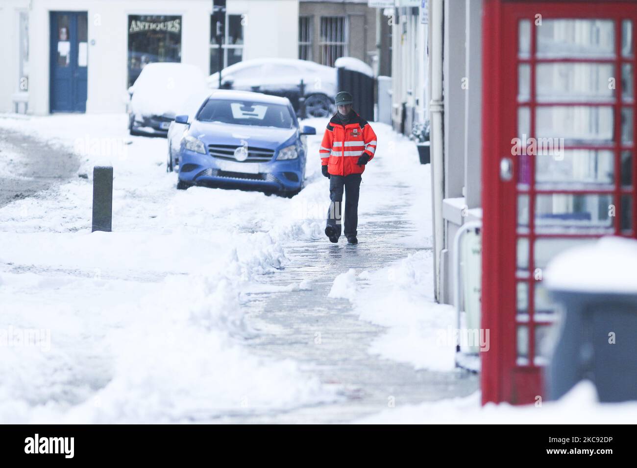 A member of the public walks through the snow on February 10, 2021 in Kelso, Scotland. Storm Darcy has caused many Yellow warnings for snow cover over much of England and Scotland, as well as parts of Northern Ireland until Wednesday with temperatures as low as -15C being forecast for parts of Scotland. (Photo by Ewan Bootman/NurPhoto) Stock Photo