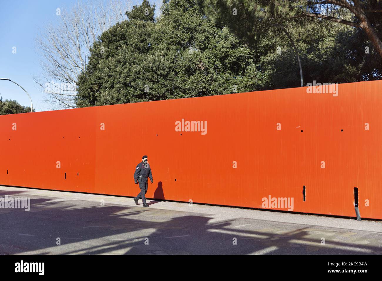 A police man patrol the area outside the vaccine center during the first day of vaccination for the over-80s in Auditorum Park of Musica in Roma on 15th of February, Italy. (Photo by Matteo Trevisan/NurPhoto) Stock Photo