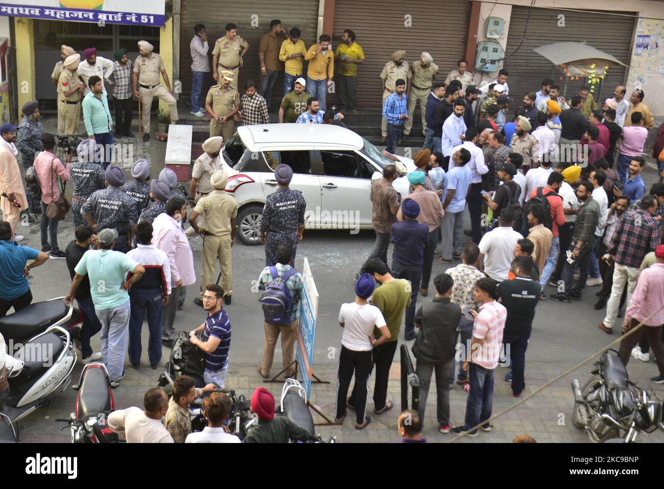 AMRITSAR, INDIA NOVEMBER 4 Police and people gather near the vehicle