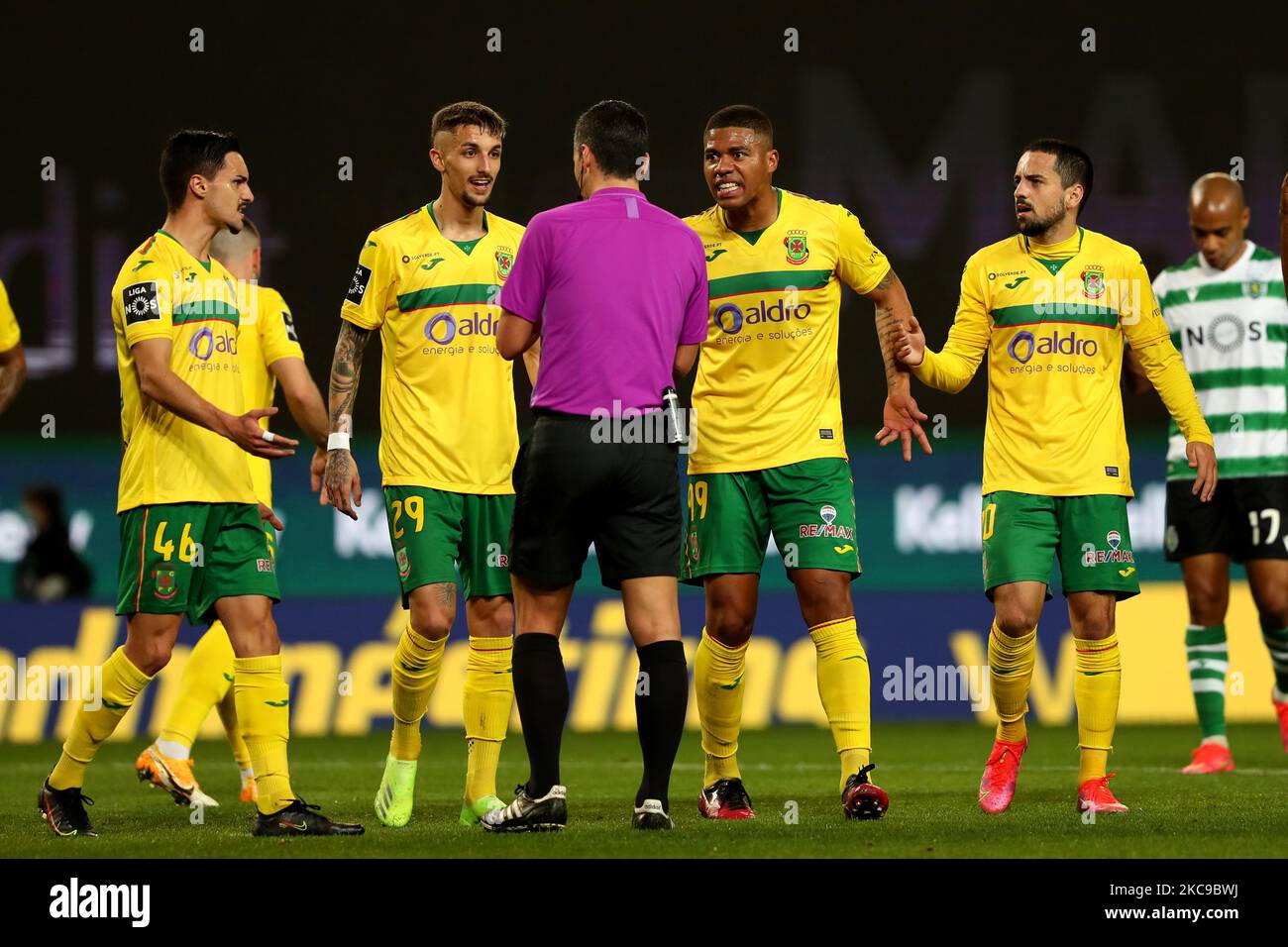 FC Pacos Ferreira's players (L to R) Stephen Eustaquio, Fernando Fonseca, Douglas Tanqueand Bruno Costa argues with Referee Andre Narciso during the Portuguese League football match between Sporting CP and FC Pacos de Ferreira at Jose Alvalade stadium in Lisbon, Portugal on February 15, 2021. (Photo by Pedro FiÃºza/NurPhoto) Stock Photo