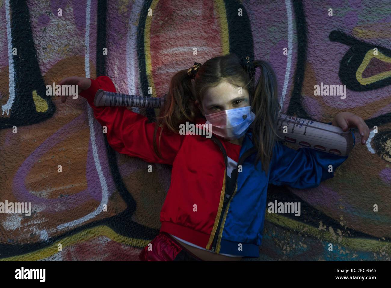 A girl poses with the costume of the comic book heroine Harley Quinn, in Santander, Spain, on February 18, 2021. Due to sanitary regulations applied by the Covid pandemic this year parades and carnival parties were prohibited to avoid congregations of many people. (Photo by Joaquin Gomez Sastre/NurPhoto) Stock Photo