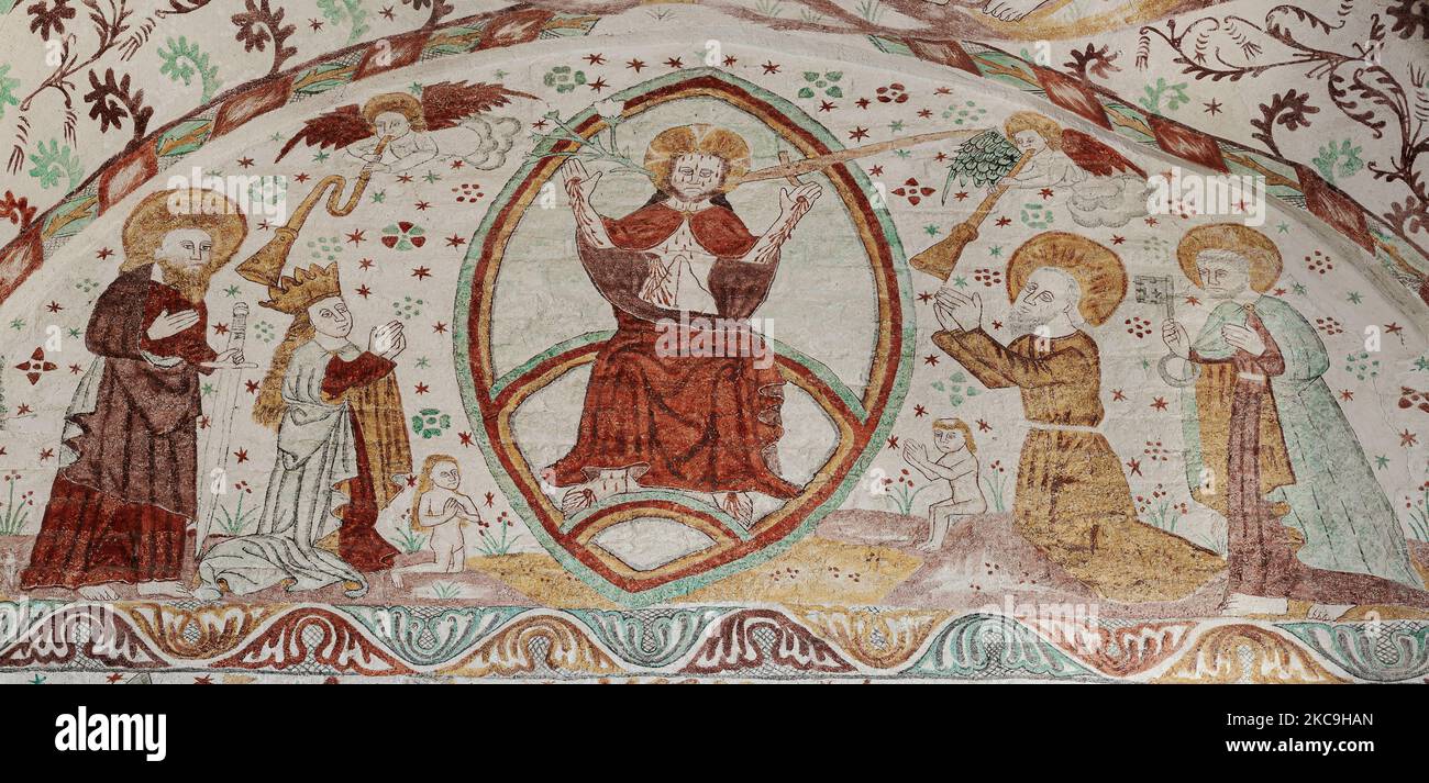 Jesus Christ sits on the rainbow on the judgment day, an old fresco in Fanefjord church, Denmark, October 10, 2022 Stock Photo