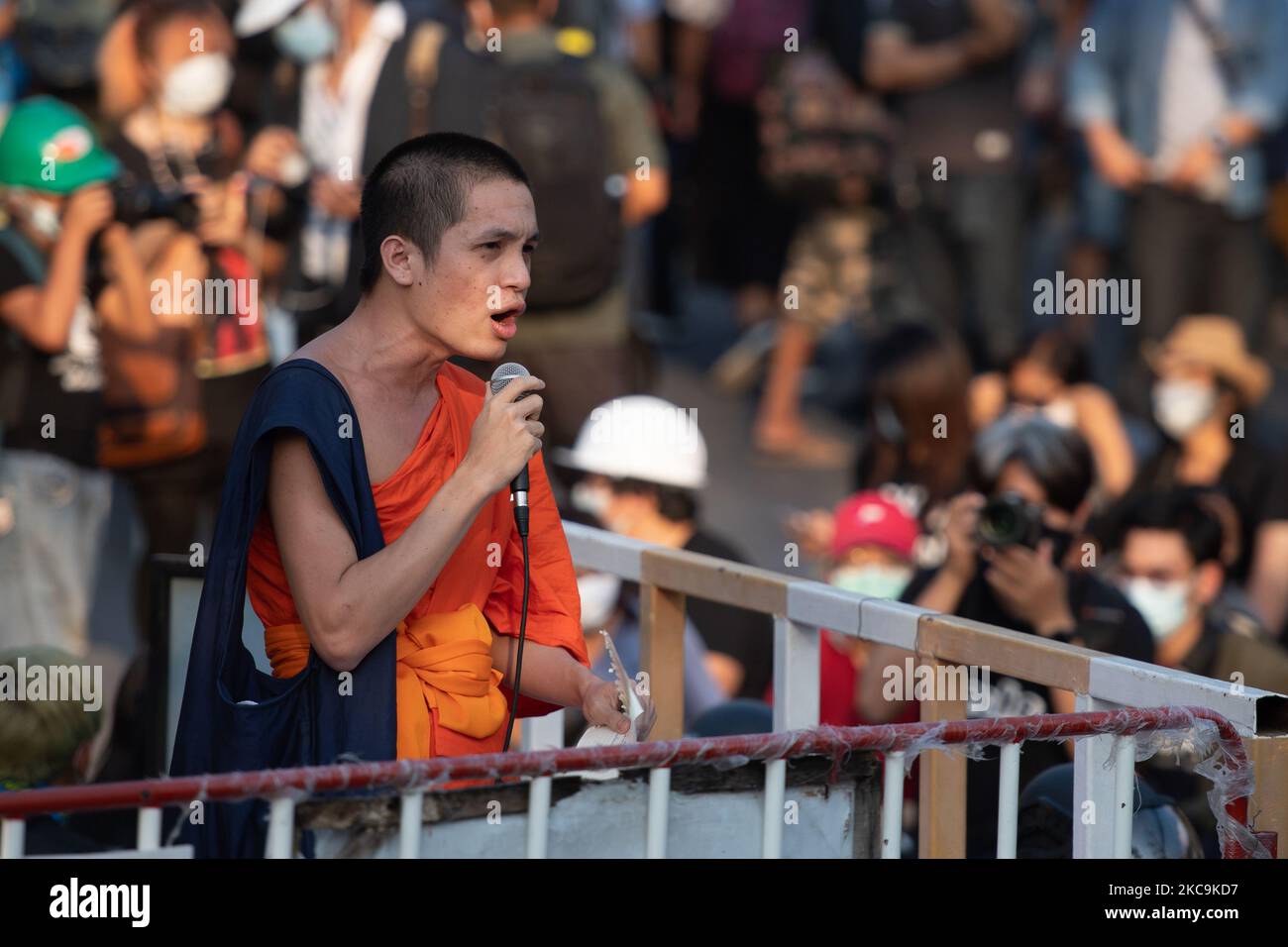 A Buddhist monk speaks to the masses during a protest outside the Parliament to call for the ouster of the Prime Minister Prayuth Chan-ochaâ€™s government on February 20, 2021 in Bangkok, Thailand. After Prime MinisterÂ PrayutÂ Chan-o-cha and nine ministers survived a parliamentary no-confidence vote. (Photo by Vachira Vachira/NurPhoto) Stock Photo