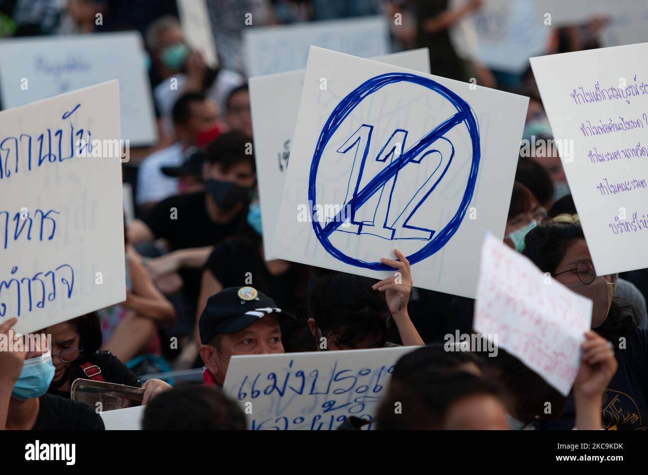 Pro-democracy protesters hold up the placards during a protest outside the Parliament to call for the ouster of the Prime Minister Prayuth Chan-ochaâ€™s government on February 20, 2021 in Bangkok, Thailand. After Prime MinisterÂ PrayutÂ Chan-o-cha and nine ministers survived a parliamentary no-confidence vote. (Photo by Vachira Vachira/NurPhoto) Stock Photo