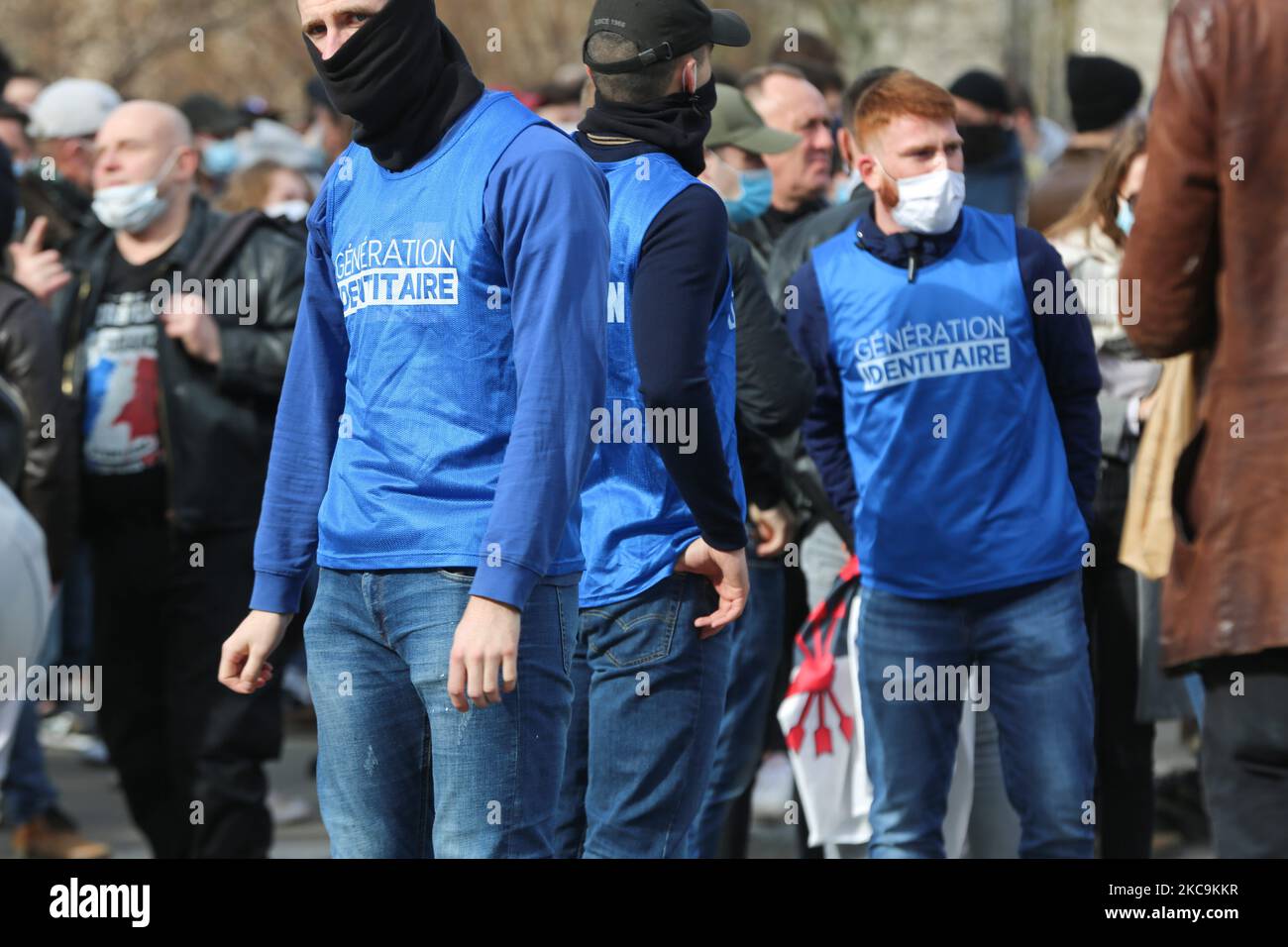 Members of far right group Generation Identitaire (GI) wear a t-shirt with the name of the group during a protest against its potential dissolutionin in Place Denfert Rochereau, in Paris on February 20, 2021. The dissolution of Generation identitaire was evoked for the first time on January 26, 2021 by Interior Minister, as a reaction to the group's recent anti-migrant operation in the Pyrenees, which led to a preliminary investigation for provocation to racial hatred. (Photo by Michel Stoupak/NurPhoto) Stock Photo
