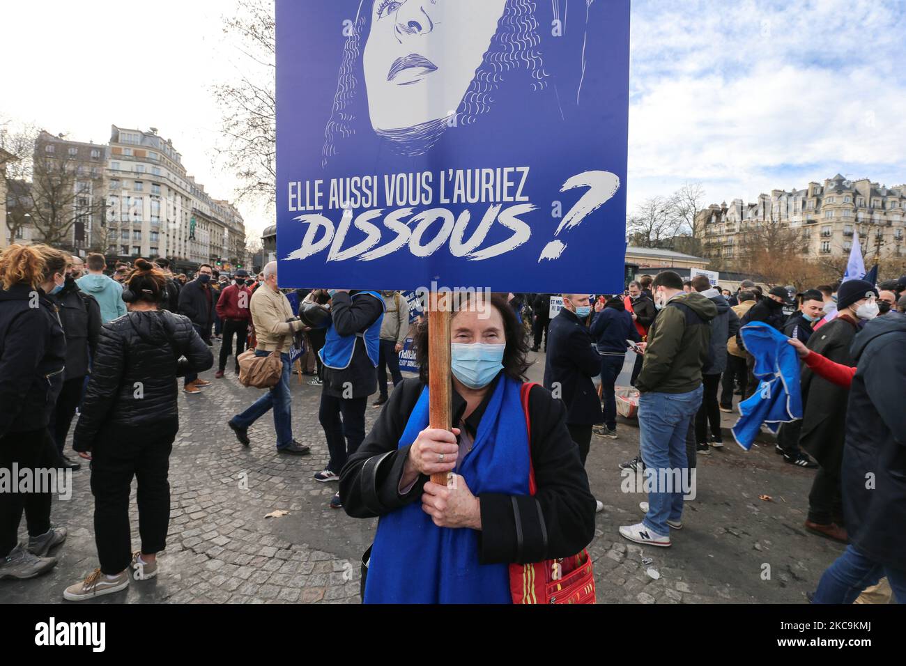 Member of far right group Generation Identitaire (GI) holds a placard with the portrait of Joan d’Arc and reading « you also would have dissolved it ? » during a protest against its potential dissolution in Place Denfert Rochereau, in Paris on February 20, 2021. The dissolution of Generation identitaire was evoked for the first time on January 26, 2021 by Interior Minister, as a reaction to the group's recent anti-migrant operation in the Pyrenees, which led to a preliminary investigation for provocation to racial hatred. (Photo by Michel Stoupak/NurPhoto) Stock Photo