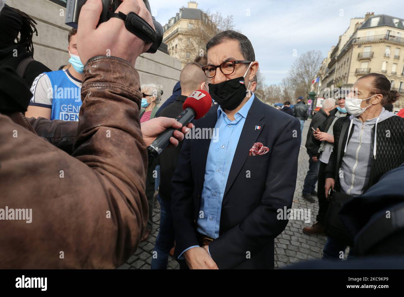 Member of far-right Rassemblement National's (RN) Jean Messiha (C) speaks with the press during a protest against the far right Generation Identitaire group's potential dissolution in Place Denfert Rochereau, in Paris on February 20, 2021. The dissolution of Generation identitaire was evoked for the first time on January 26, 2021 by Interior Minister, as a reaction to the group's recent anti-migrant operation in the Pyrenees, which led to a preliminary investigation for provocation to racial hatred. (Photo by Michel Stoupak/NurPhoto) Stock Photo