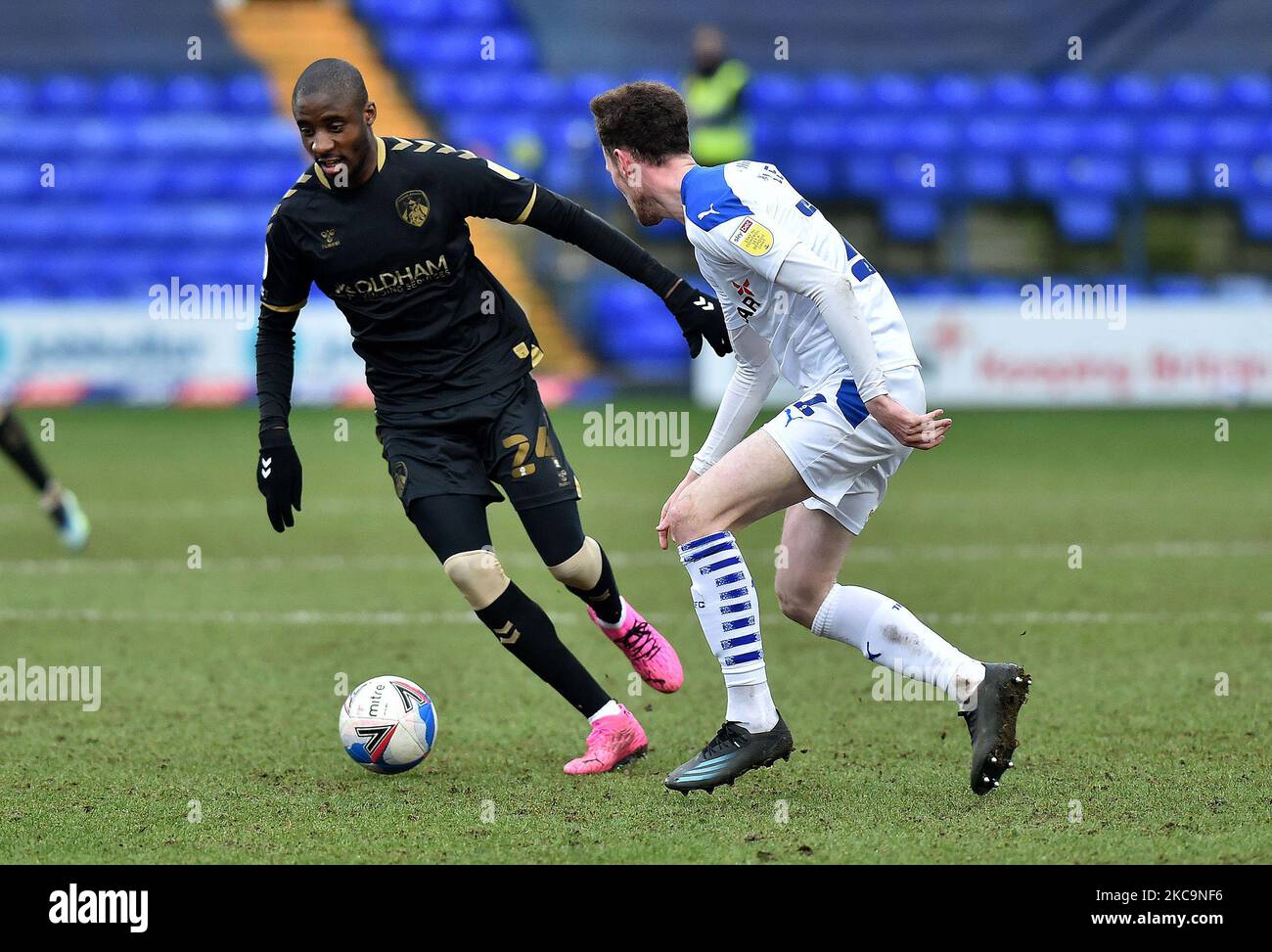 Oldham Athletic's Dylan Bahamboula tussles with Paul Lewis of Tranmere Rovers during the Sky Bet League 2 match between Tranmere Rovers and Oldham Athletic at Prenton Park, Birkenhead on Saturday 20th February 2021. (Photo by Eddie Garvey/MI News/NurPhoto) Stock Photo