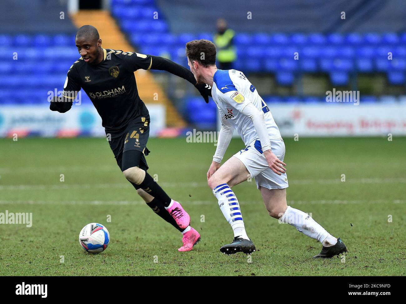 Oldham Athletic's Dylan Bahamboula tussles with Paul Lewis of Tranmere Rovers during the Sky Bet League 2 match between Tranmere Rovers and Oldham Athletic at Prenton Park, Birkenhead on Saturday 20th February 2021. (Photo by Eddie Garvey/MI News/NurPhoto) Stock Photo