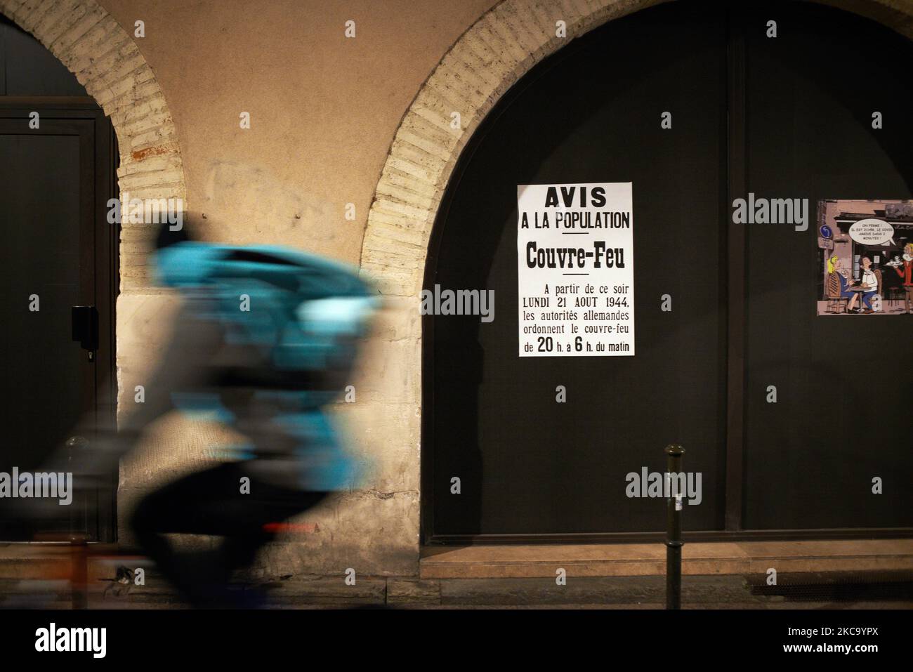 An Uber Delivery Man Cycles In Front Of A Leaflet Reading Public an-uber-delivery-man-cycles-in-front-of-a-leaflet-reading-public