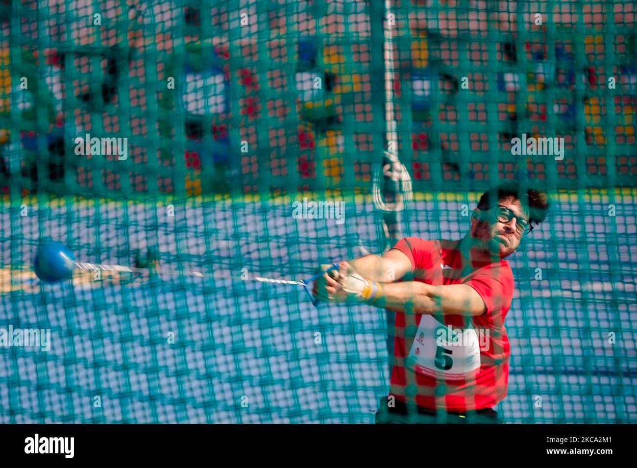 An athlete competing at the hammer throw during the Italian Winter Long