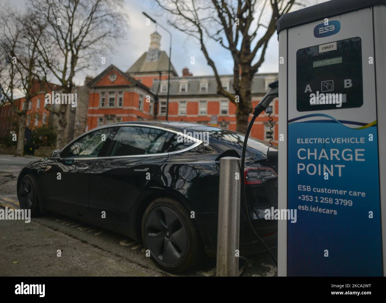 Tesla car connected to an electric vehicle charging point in Dublin