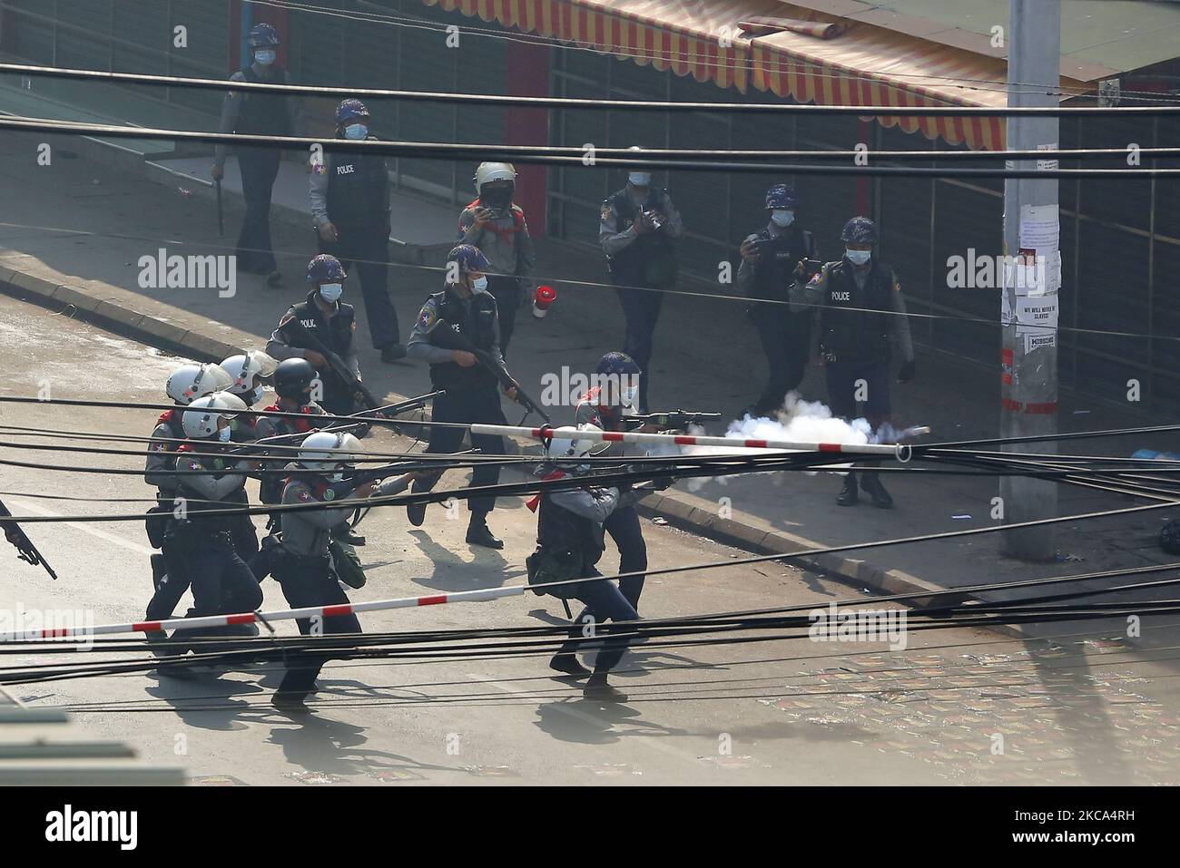 Riot police fire tear gas at protesters during a violent crackdown on demonstrations against the military coup in Yangon, Myanmar on February 28, 2021. (Photo by Myat Thu Kyaw/NurPhoto) Stock Photo