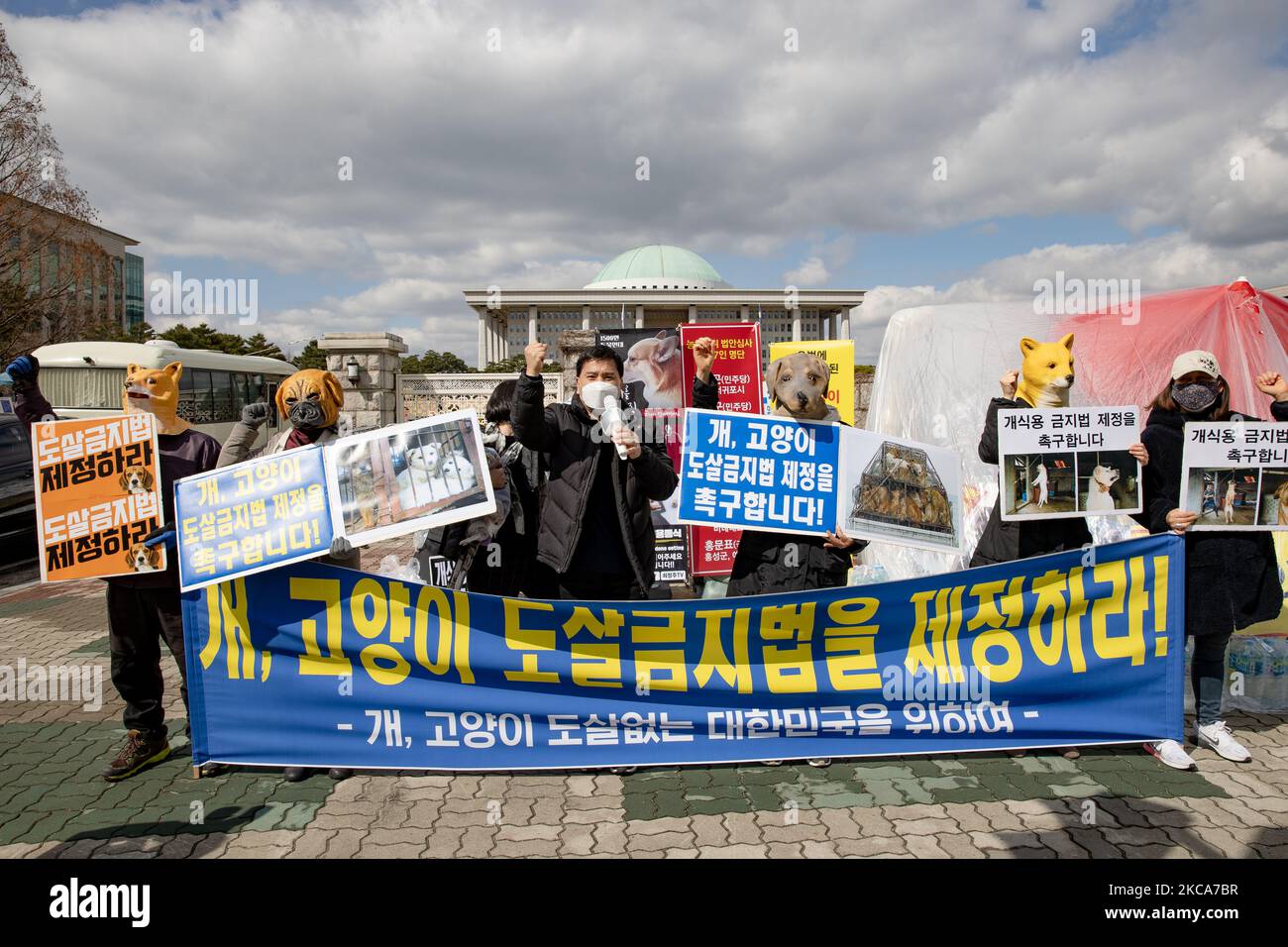 Members of civic groups, including the Korea Animal Protection