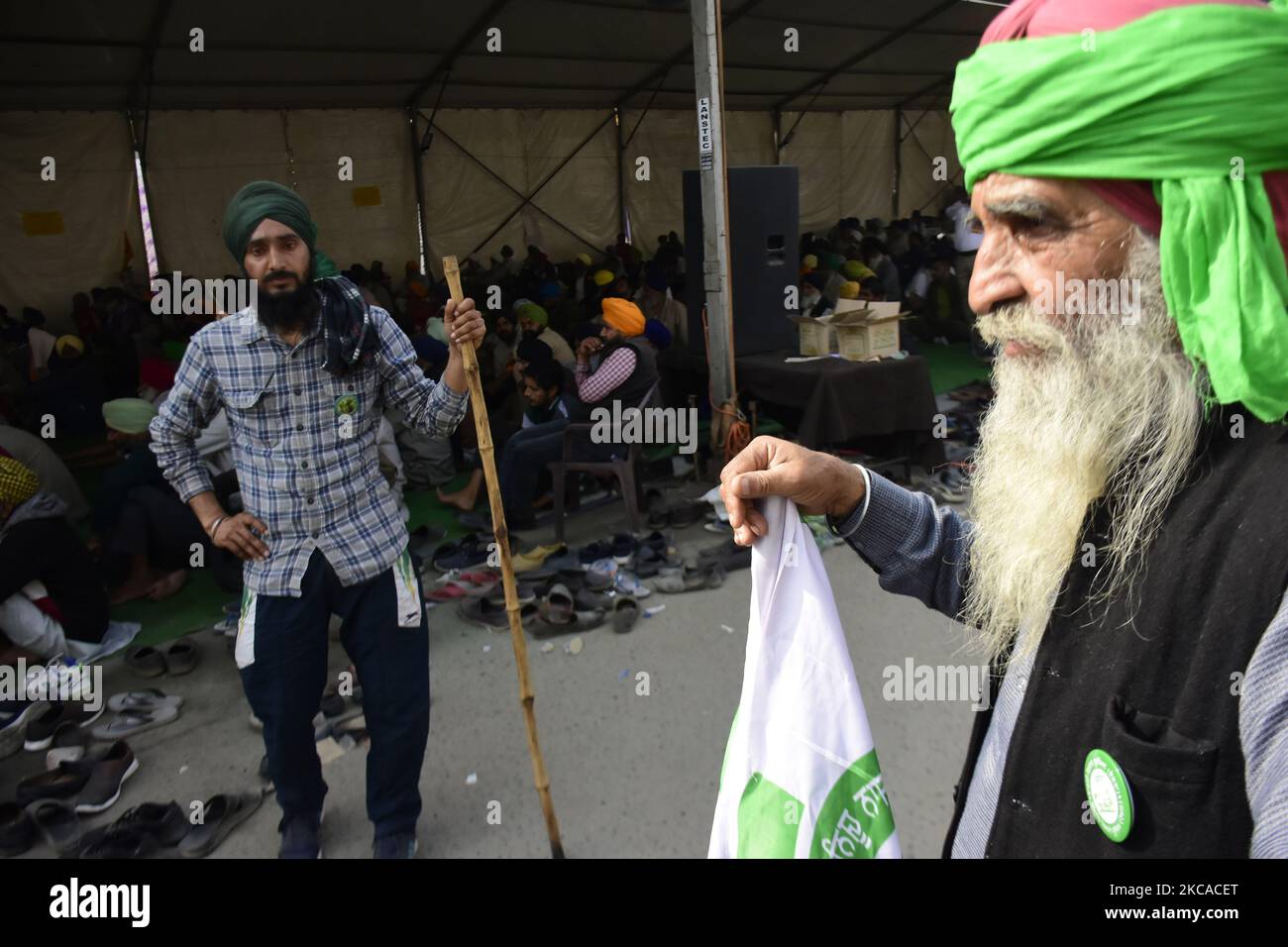 Indian farmers stand vigil near the main protest site at Singhu border which connects with New