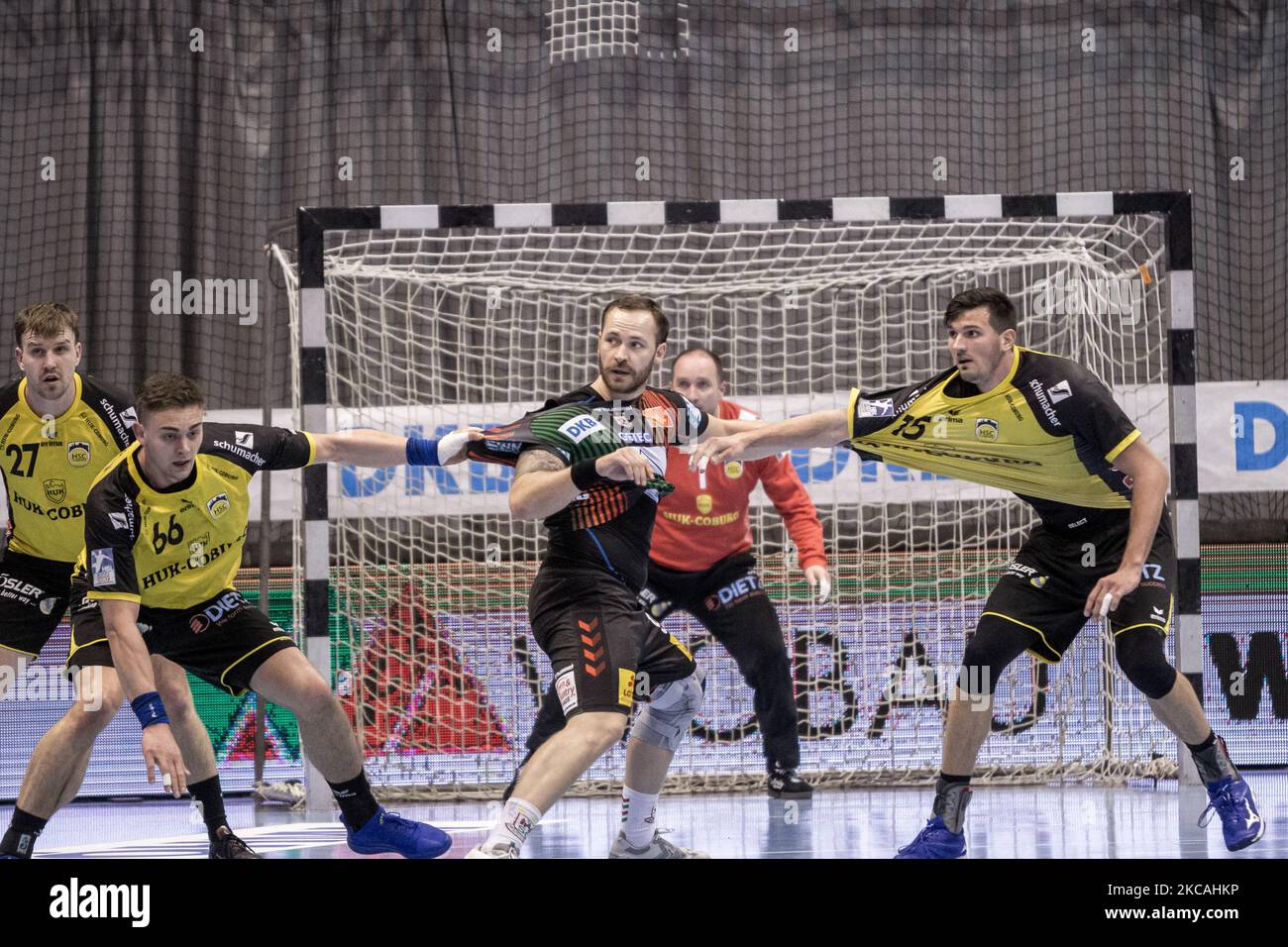 Moritz Preuss of SC Magdeburg (mi.) is attacked by Stepan Zeman (left) and Drasko Nenadic (right) of HSC 2000 Coburg during the LIQUI MOLY Handball-Bundesliga match between SC Magdeburg and HSC 2000 Coburg at GETEC-Arena on March 07, 2021 in Magdeburg, Germany. (Photo by Peter Niedung/NurPhoto) Stock Photo