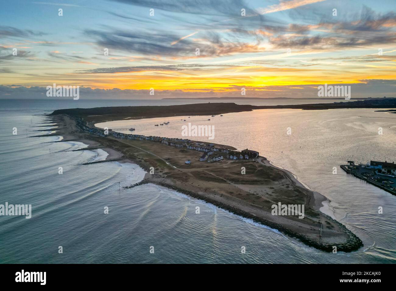 View from the air of the autumn sunset at Mudeford Spit at Mudeford in Dorset, UK. Stock Photo