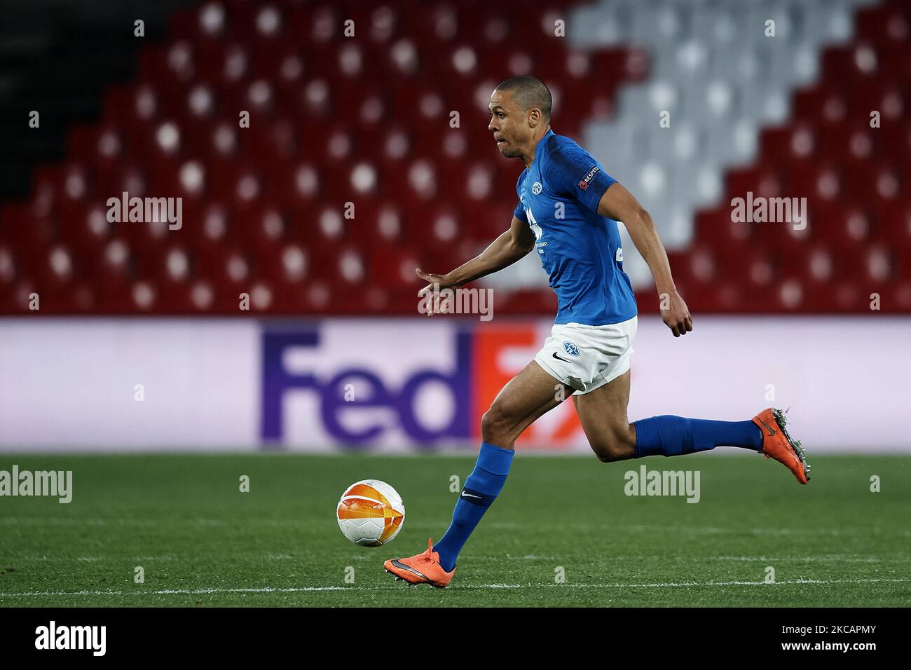 Mathis Bolly of Molde runs with the ball during the UEFA Europa League Round of 16 First Leg match between Granada and Molde at Estadio Nuevo Los Carmenes on March 11, 2021 in Granada, Spain. Sporting stadiums around Europe remain under strict restrictions due to the Coronavirus Pandemic as Government social distancing laws prohibit fans inside venues resulting in games being played behind closed doors. (Photo by Jose Breton/Pics Action/NurPhoto) Stock Photo