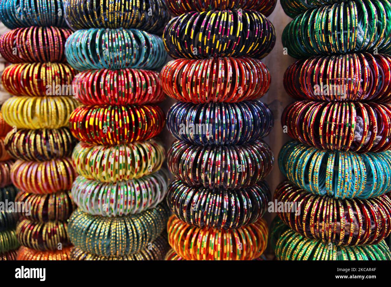 Colourful glass bangles displayed at a shop in the bangle market at