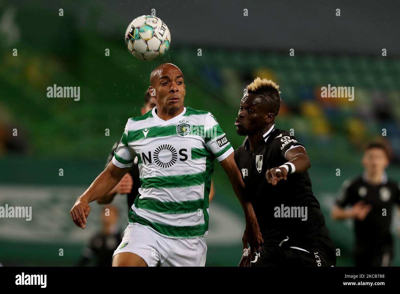 Joao Mario of Sporting CP (L) vies with Falaye Sacko of Vitoria SC during the Portuguese League football match between Sporting CP and Vitoria SC at Jose Alvalade stadium in Lisbon, Portugal on March 20, 2021. (Photo by Pedro FiÃºza/NurPhoto) Stock Photo