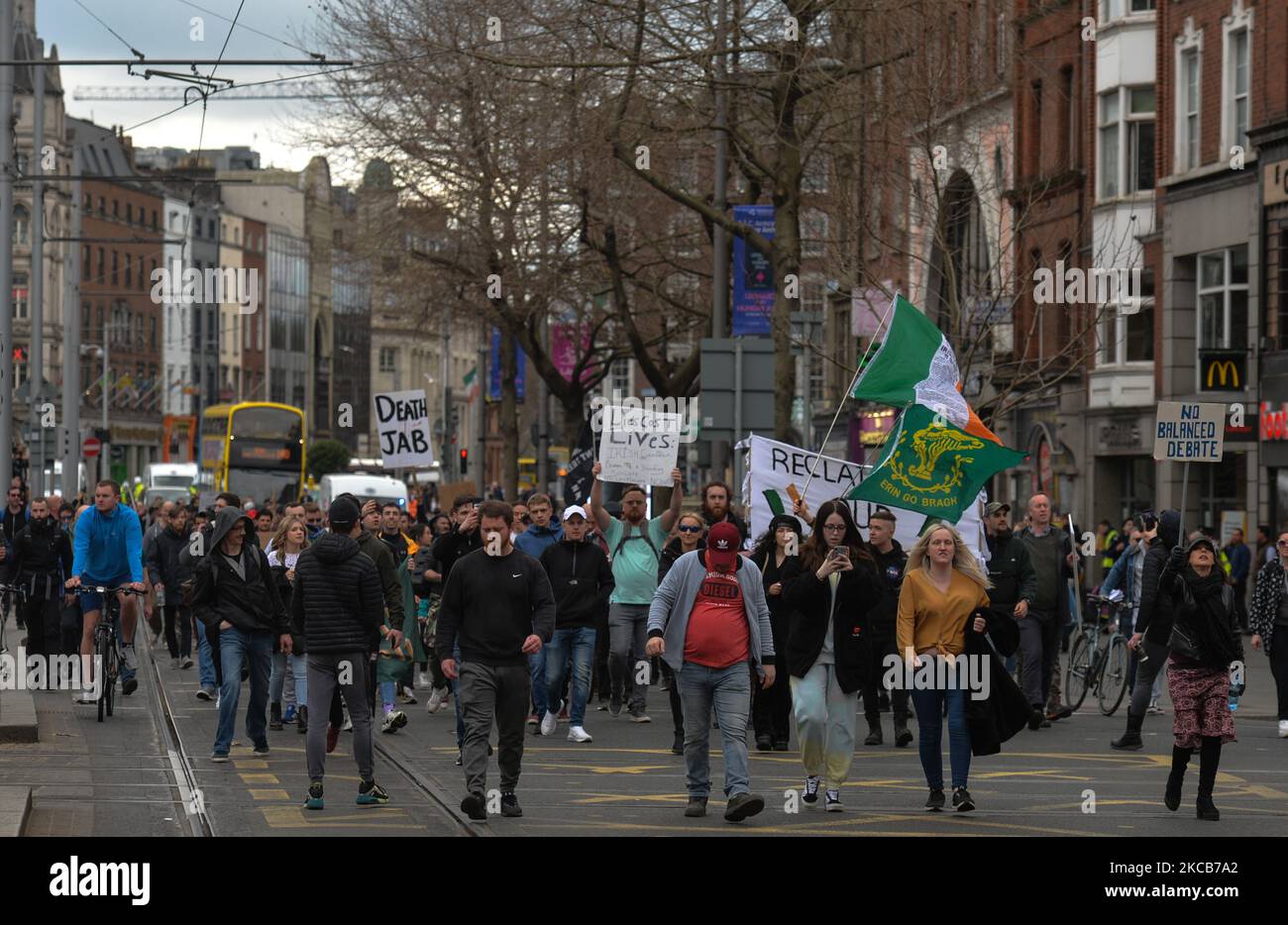 Protesters march on O'Connell Street during an Anti-Lockdown and Anti-Vaccine rally on the World Freedom Day in Dublin. On Saturday, March 20, 2021, in Dublin, Ireland. (Photo by Artur Widak/NurPhoto) Stock Photo