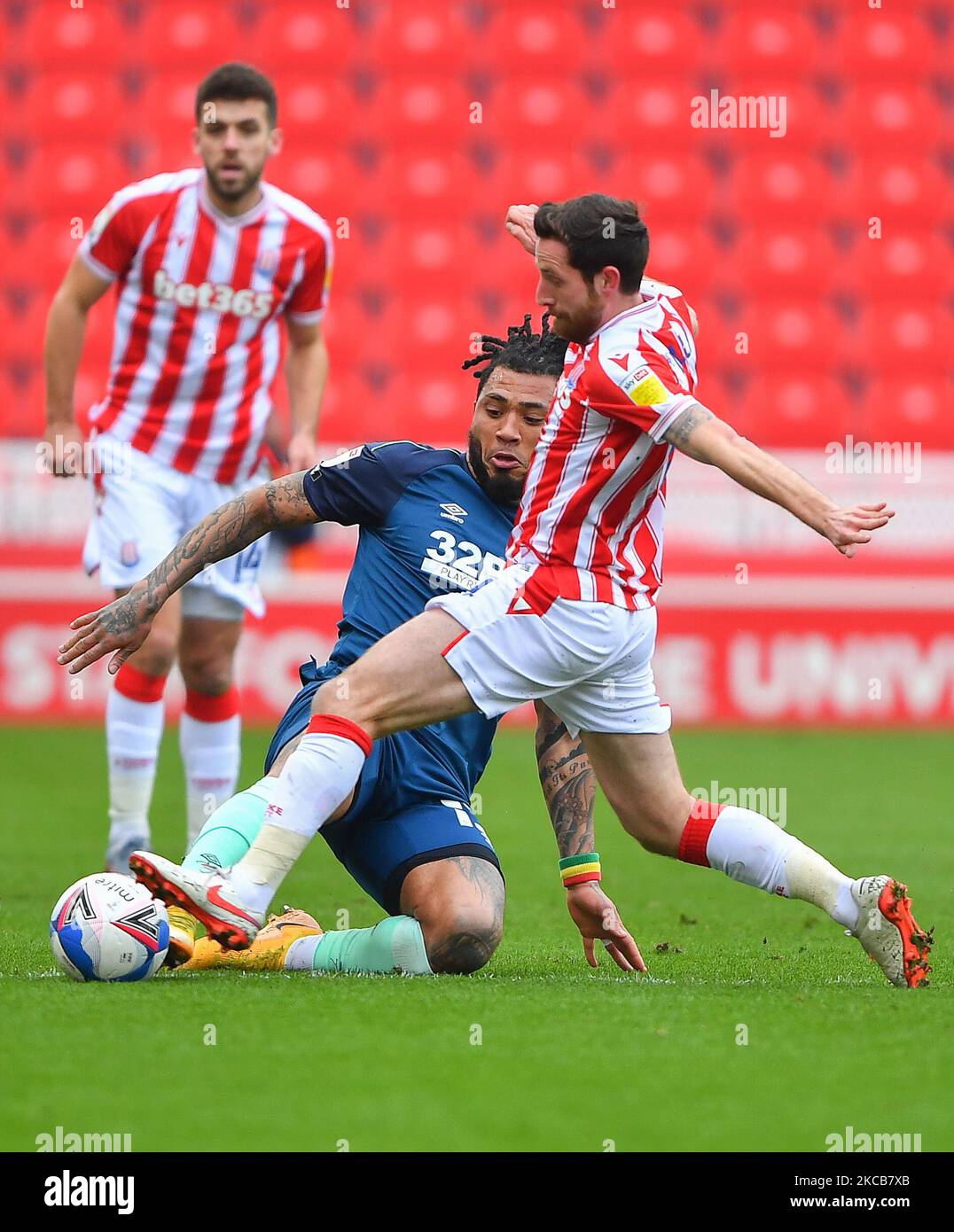 Colin Kazim-Richards of Derby County and Tommy Smith (14) of Stoke City battle for the ball during the Sky Bet Championship match between Stoke City and Derby County at the Britannia Stadium, Stoke-on-Trent on Saturday 20th March 2021. (Photo by Jon Hobley/MI News/NurPhoto) Stock Photo