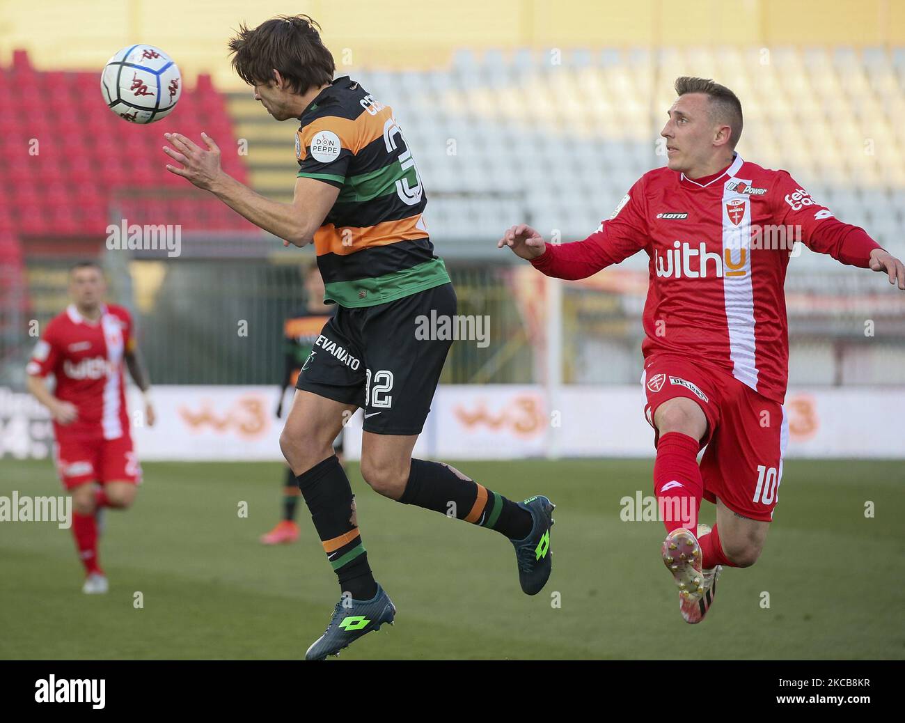 Pietro Ceccaroni of Venezia FC (L) competes for the ball with Andrea D'Errico of AC Monza (R) during the Serie B match between AC Monza and Venezia FC at Stadio Brianteo on March 20, 2021 in Monza, Italy. (Photo by Giuseppe Cottini/NurPhoto) Stock Photo