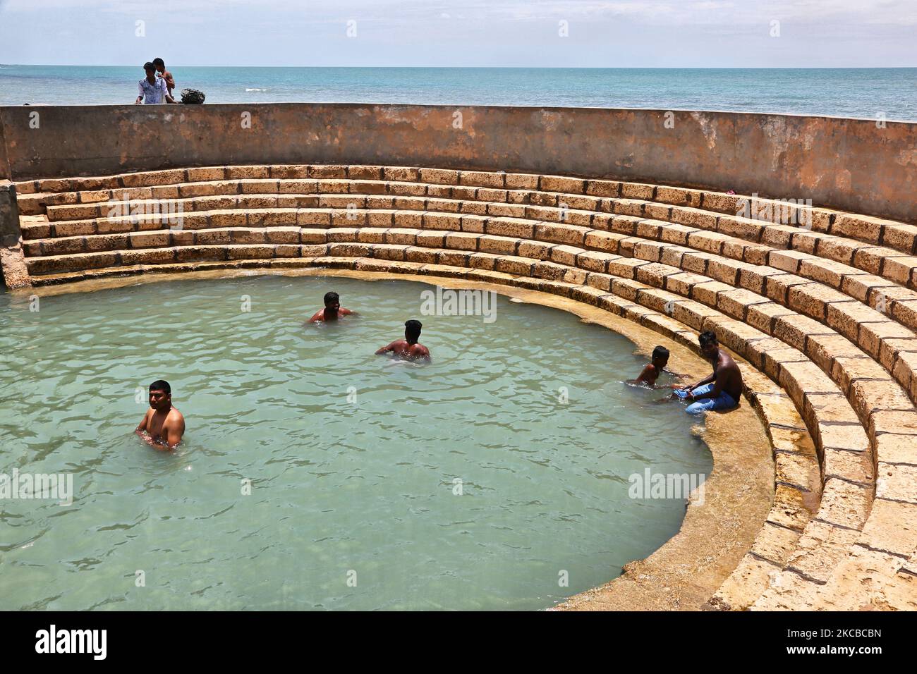 Hindu devotees bathe in the Keerimalai Sacred Hot Springs on the