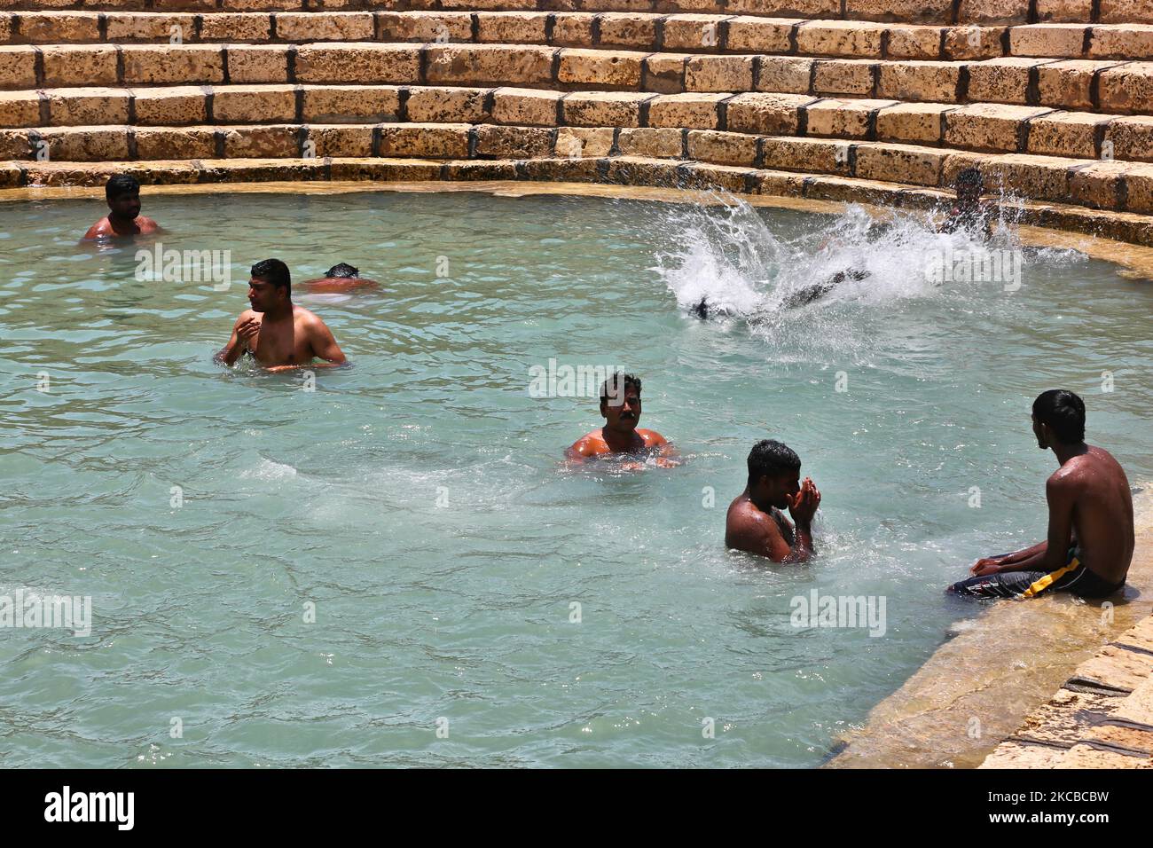 Hindu devotees bathe in the Keerimalai Sacred Hot Springs on the