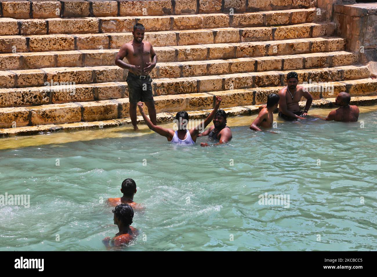 Hindu devotees bathe in the Keerimalai Sacred Hot Springs on the
