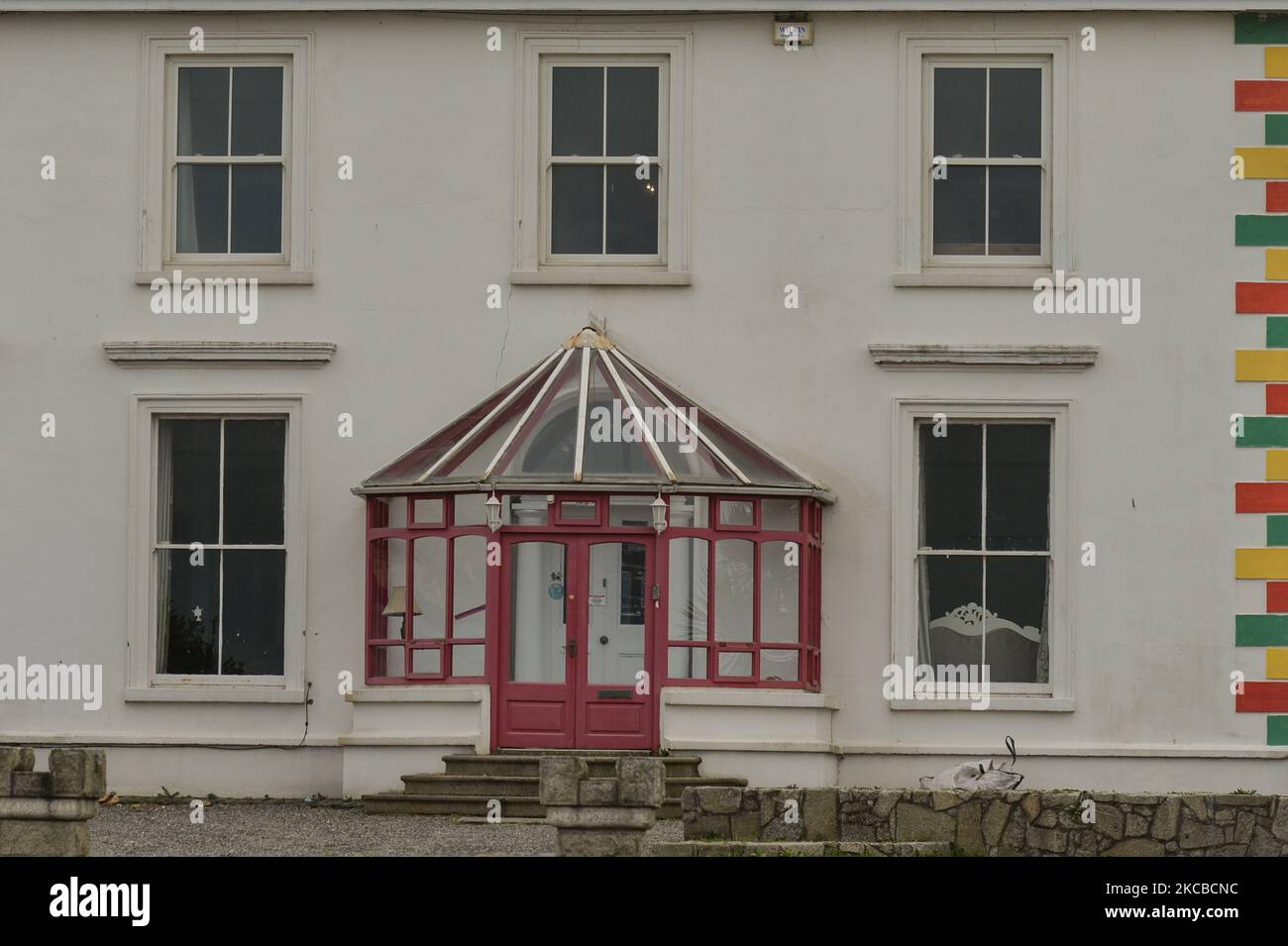Facade of sinead oconnors colourful seafront home hires stock