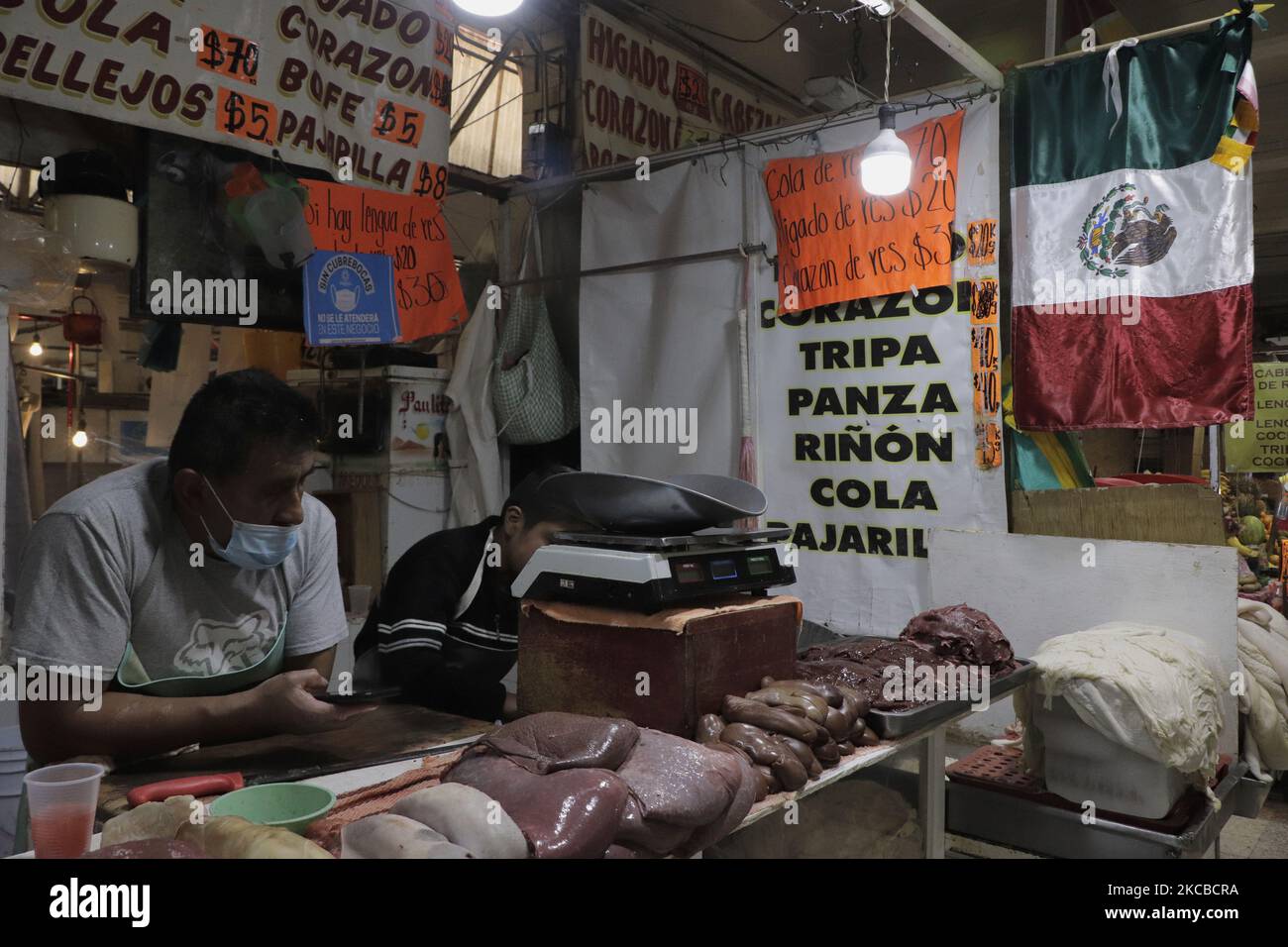Beef and pork viscera vendors inside the Xochimilco Market in Mexico City during the COVID-19 emergency and the orange epidemiological traffic light in the capital. Recently, the Xochimilco municipality announced the mandatory use of masks and established new preventive measures against COVID-19 that must be complied with to avoid being taken to the district's Civic Court. The measure was published in the Official Gazette of Mexico City and indicates that the use of masks will be mandatory in markets, public roads, sports and recreational areas while there is a pandemic. (Photo by Gerardo Viey Stock Photo