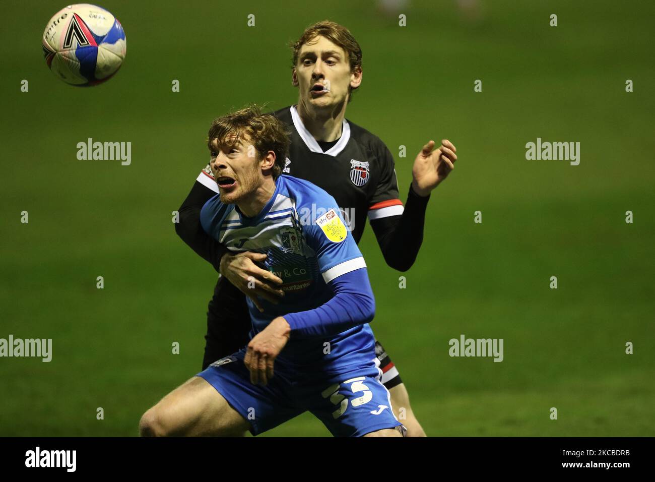 Luke James of Barrow and Elliott Hewitt of Grimsby Town during the Sky Bet League 2 match between Barrow and Grimsby Town at the Holker Street, Barrow-in-Furness on Tuesday 23rd March 2021. (Photo by Mark Fletcher/MI News/NurPhoto) Stock Photo