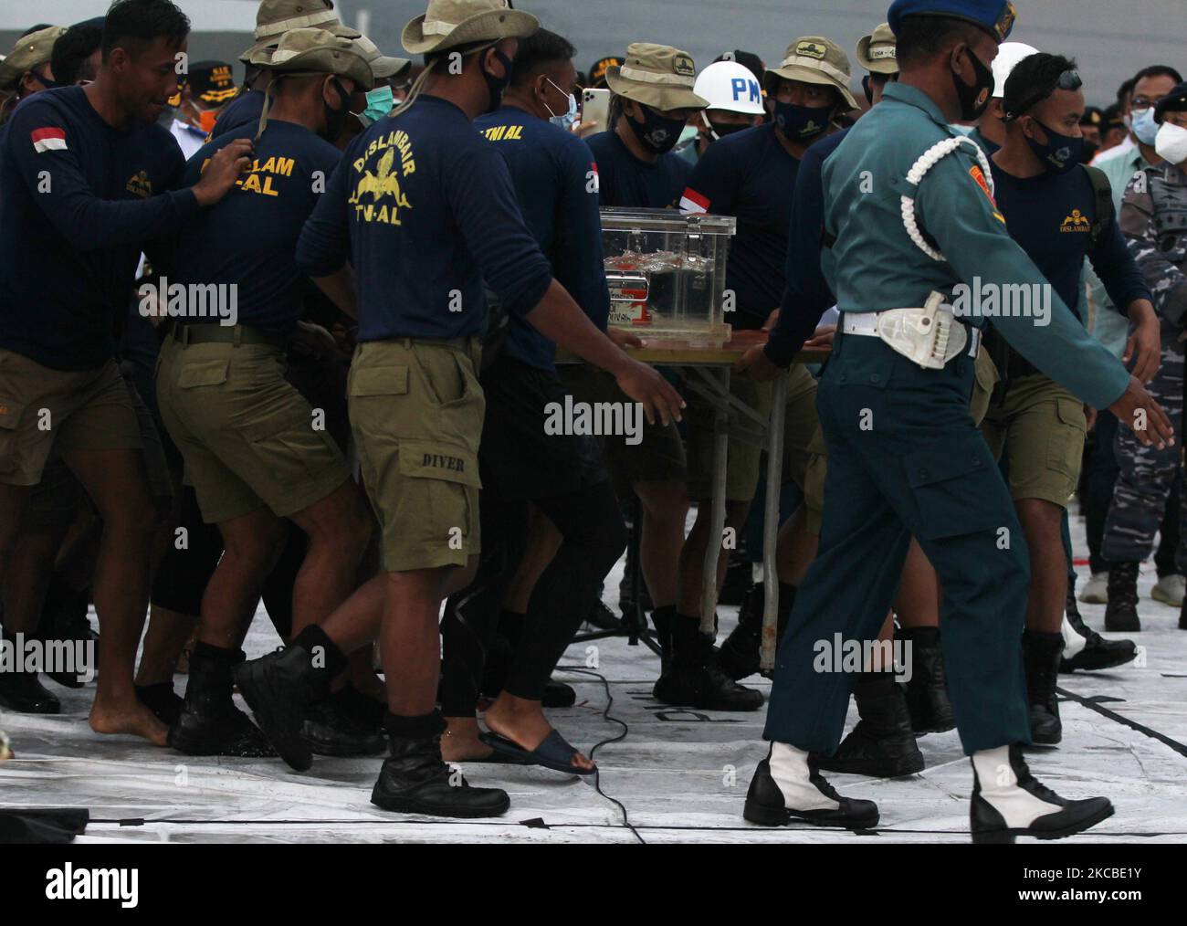 The Sriwijaya Air airline blackbox was found and entered into a special place to be taken for investigation at JICT pier, Tanjung Priok port, Jakarta on January 12, 2021. The search for the black box or black box of the Sriwijaya Air SJ182 aircraft that crashed in the waters around the island of Laki-Pulau Lancang, Jakarta after four days of searching. The blackbox was found by the Indonesian National Army (TNI) Navy. (Photo by Dasril Roszandi/NurPhoto) Stock Photo