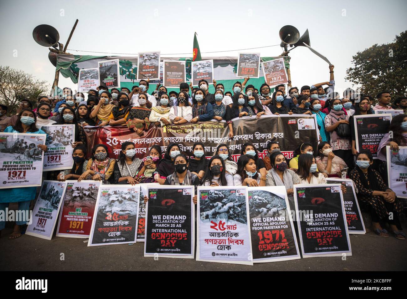 Students from Dhaka University holds placards of dead martyrs who have shot to death in march 25, 1971 by the Pakistani soldiers in Dhaka on March 25, 2021. (Photo by Ahmed Salahuddin/NurPhoto) Stock Photo