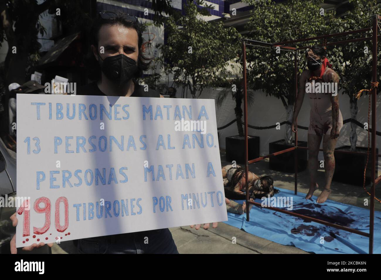 Activists from the organization Animal Save Mexico, demonstrate outside a restaurant of the Fisher's chain in Mexico City against the mistreatment and exploitation of marine species for human consumption during the COVID-19 health emergency and the orange epidemiological traffic light in the capital. (Photo by Gerardo Vieyra/NurPhoto) Stock Photo