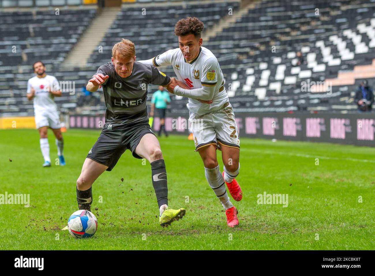 Doncaster Rovers Brad Halliday is challenged by Milton Keynes Dons Matthew Sorinola during the second half of the Sky Bet League One match between MK Dons and Doncaster Rovers at Stadium MK, Milton Keynes on Saturday 27th March 2021. (Photo by John Cripps/MI News/NurPhoto) Stock Photo