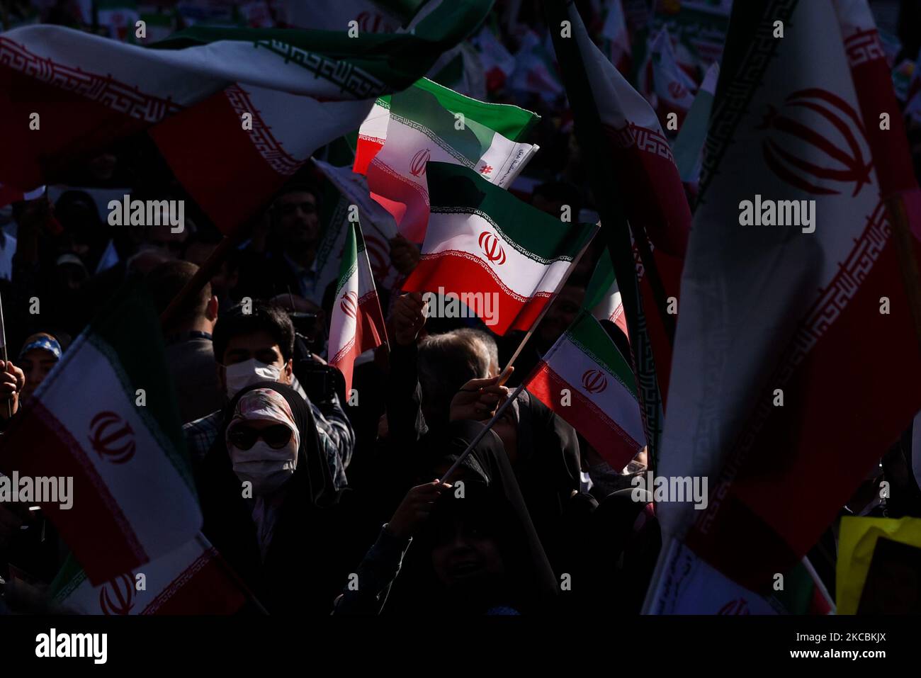 Tehran, Iran. 04th Nov, 2022. A woman waves the Iranian flags during a demonstration in front of the former U.S. Embassy in Tehran, Iran, Friday, Nov. 4, 2022. Iran on Friday marked the 1979 takeover of the U.S. Embassy in Tehran as its theocracy faces nationwide protests after the death of a 22-year-old woman earlier arrested by the country's morality police. (Photo by Sobhan Farajvan/Pacific Press) Credit: Pacific Press Media Production Corp./Alamy Live News Stock Photo