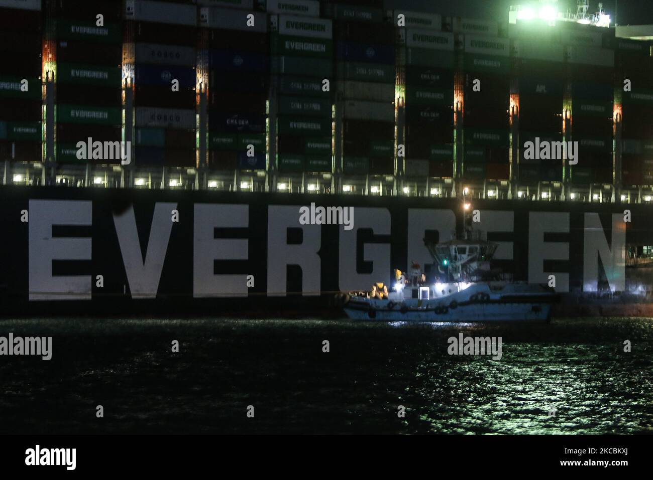 A general view of ''Ever Given'', a container ship which is currently stuck in the Suez canal, during a tugging attempt to re-float it, in Suez, Egypt, on March 27, 2021. The state-run Suez Canal Authority (SCA) announced that nearly 17,000 cubic meters of sand have been dredged around the ship after navigation through the Suez Canal has been temporarily stoped which has been wedged diagonally across the span of the canal about six kilometres north of the Suez Canal's entrance by the Red Sea port city of Suez since March 23, blocking the waterway in both directions (Photo by Ziad Ahmed/NurPhot Stock Photo