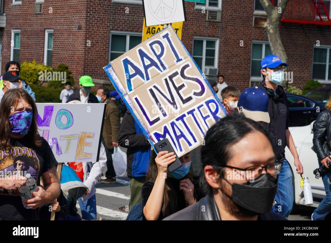 Demonstrators hold signs during an AAPI Rally Against Hate in Flushing, Queens, New York, U.S., on Saturday, March 27, 2021. Stop AAPI Hate, a group that tracks anti-Asian violence, said it had received nearly 3,800 reports of hate incidents since mid March, 2020, around the time that the Covid-19 pandemic seized the U.S. More than 500 of those came in the first two months of 2021. (Photo by John Nacion/NurPhoto) Stock Photo