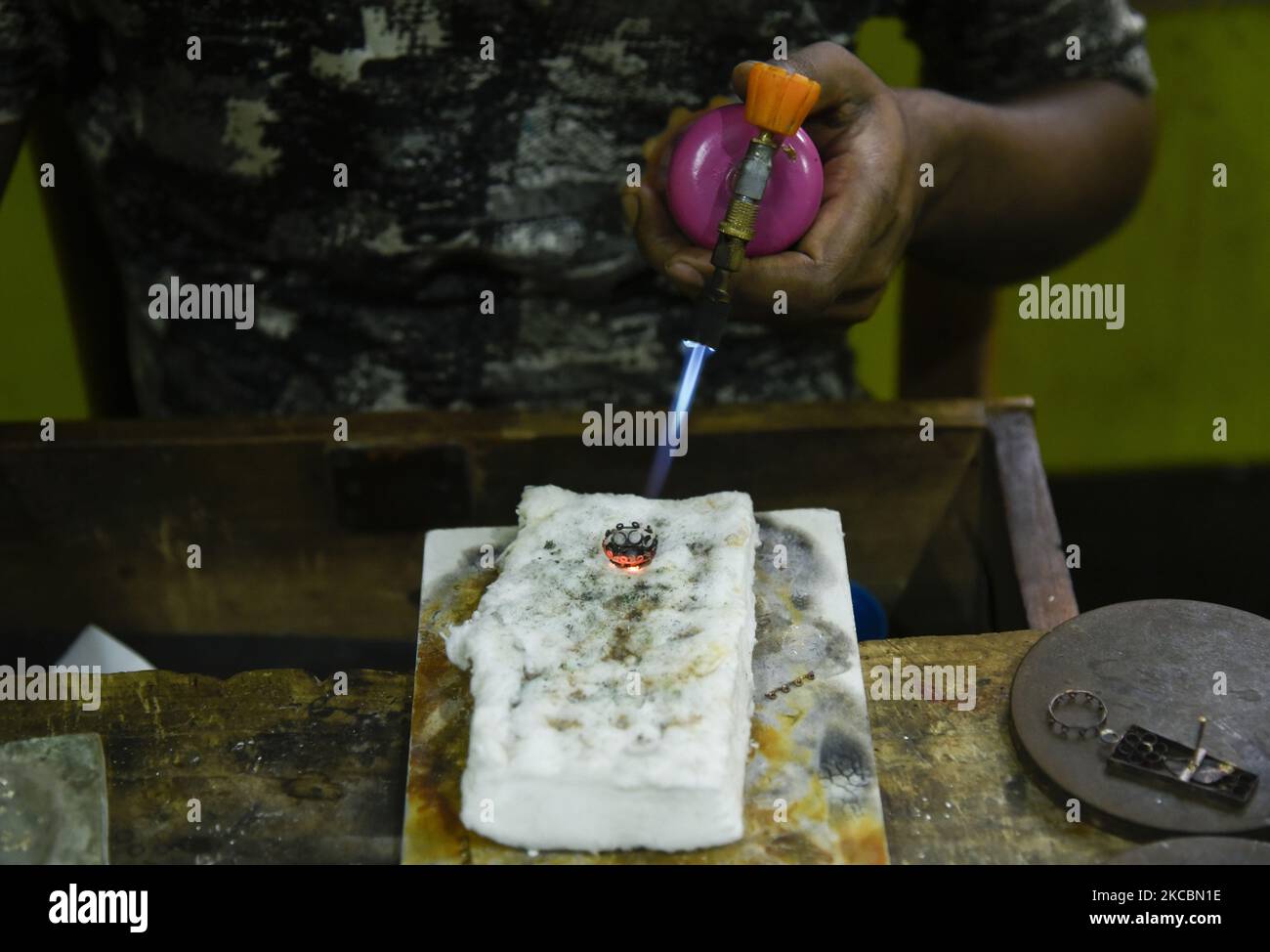 Jeweller manufacturing Assamese Traditional Jewellery at a workshop ...