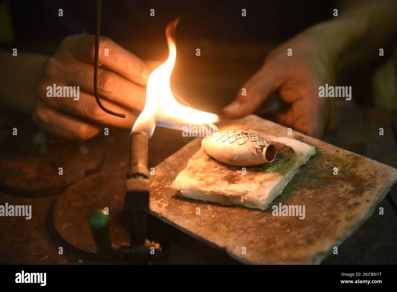 Jeweller manufacturing Assamese Traditional Jewellery at a workshop ...