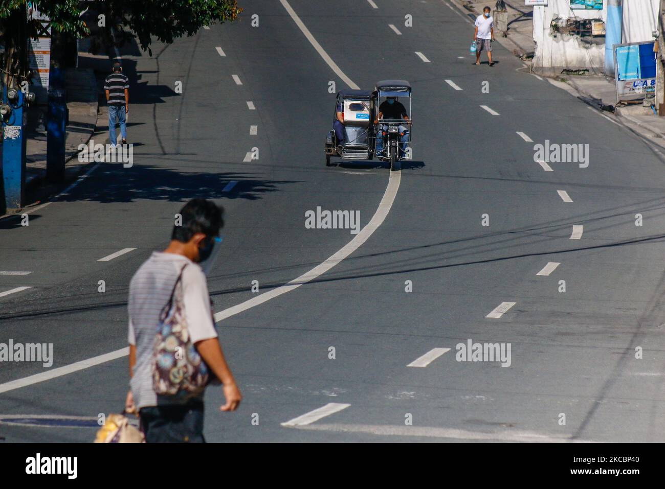 Few vehicles and residents are seen in downtown of Antipolo City, Rizal on first day of ECQ in Greater Manila Area, Philippines on March 29, 2021. The Government reimposed the Enhanced Community Quarantine in NCR Bubble including the province of Rizal, Cavite, Laguna and Bulacan from March 29 to April 4, 2021 due to massive daily counts of COVID-19 in Philippines. As of March 28, the country reported 9,475 new cases with 721,891 total of COVID-19 cases and total death of 13,170. (Photo by Ryan Eduard Benaid/NurPhoto) Stock Photo