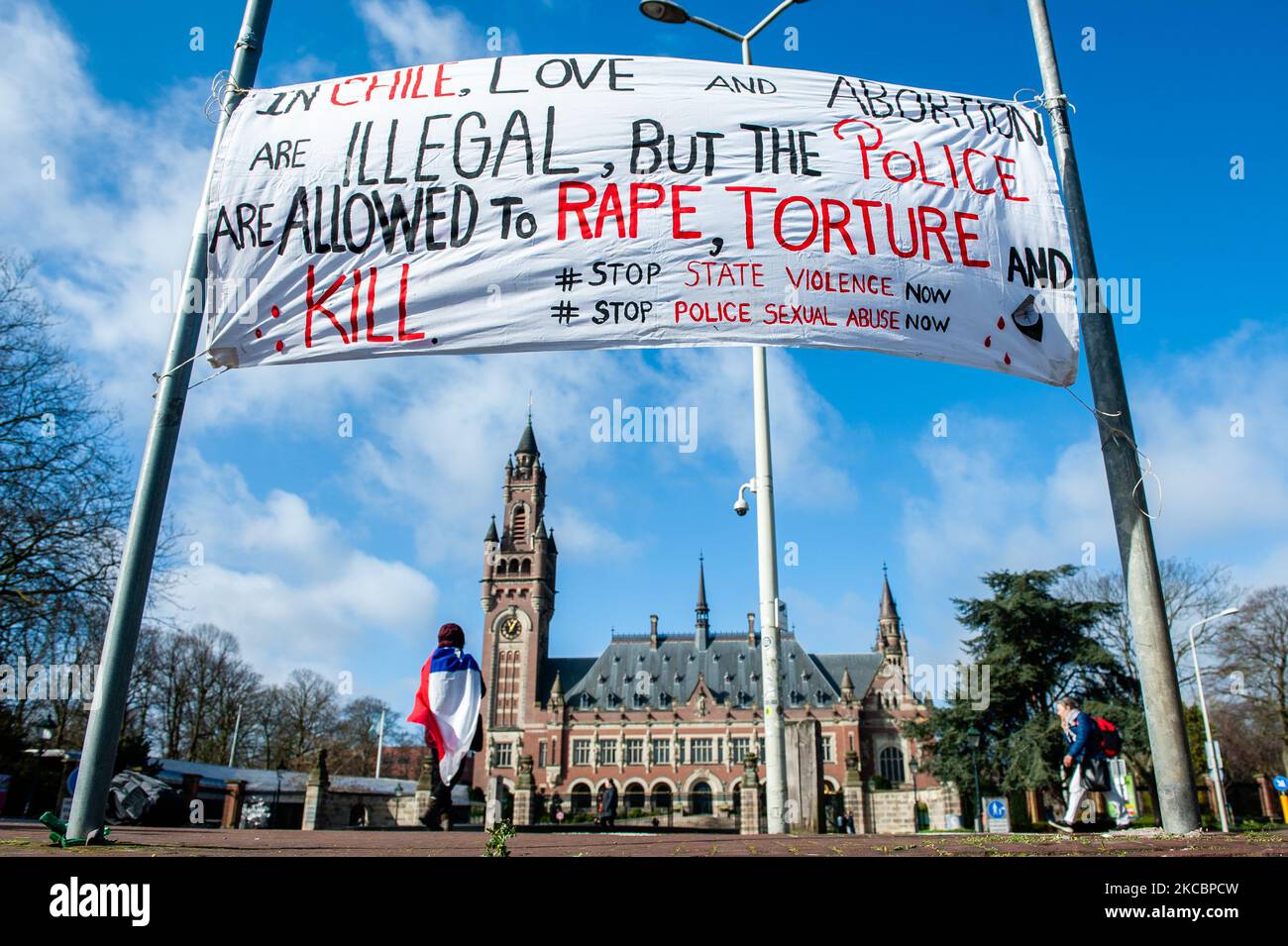 A banner against Chilean president Piñera is hanging in front of the Peace Palace in The Hague, during a performance against Piñera, on March 29th, 2021. (Photo by Romy Arroyo Fernandez/NurPhoto) Stock Photo