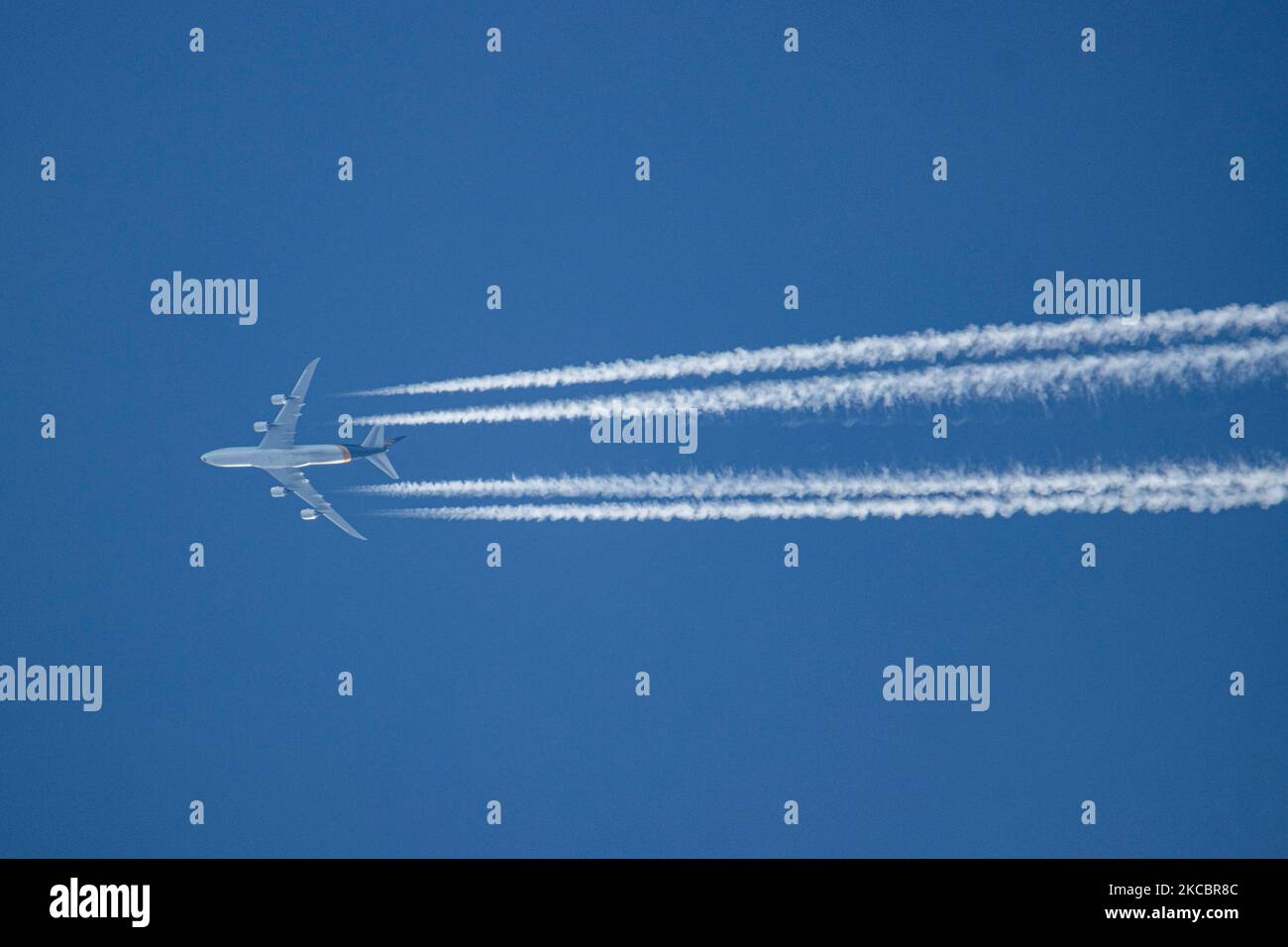 A UPS Boeing 7478F aircraft as seen flying in the blue sky over the